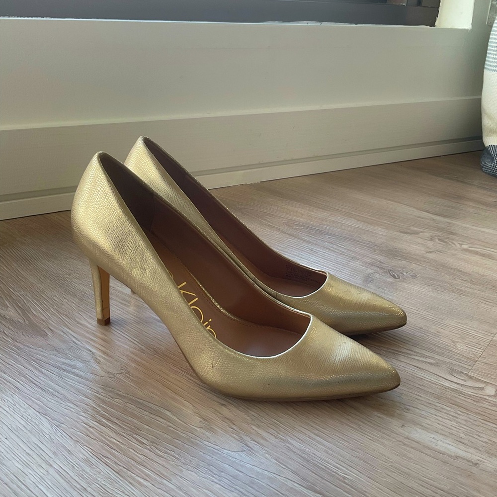 Calvin Klein gold stilettos